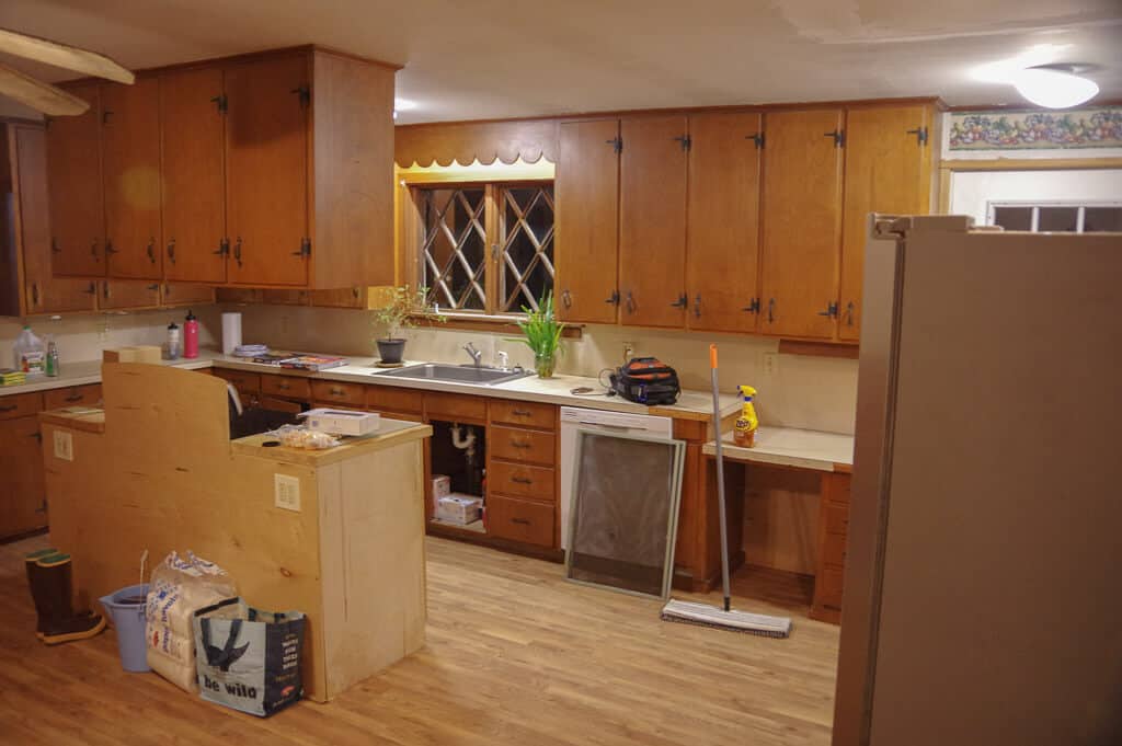 Photo of kitchen with cabinet and windows