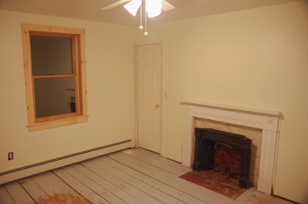 Room with window and fireplace