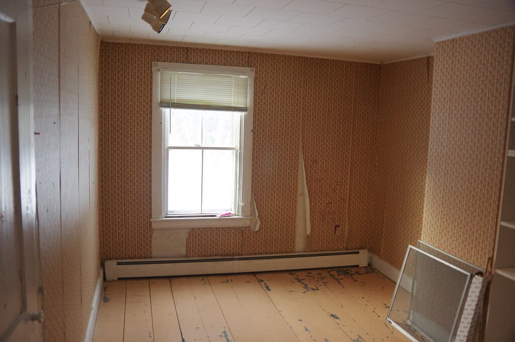 Room with floral wallpaper and window