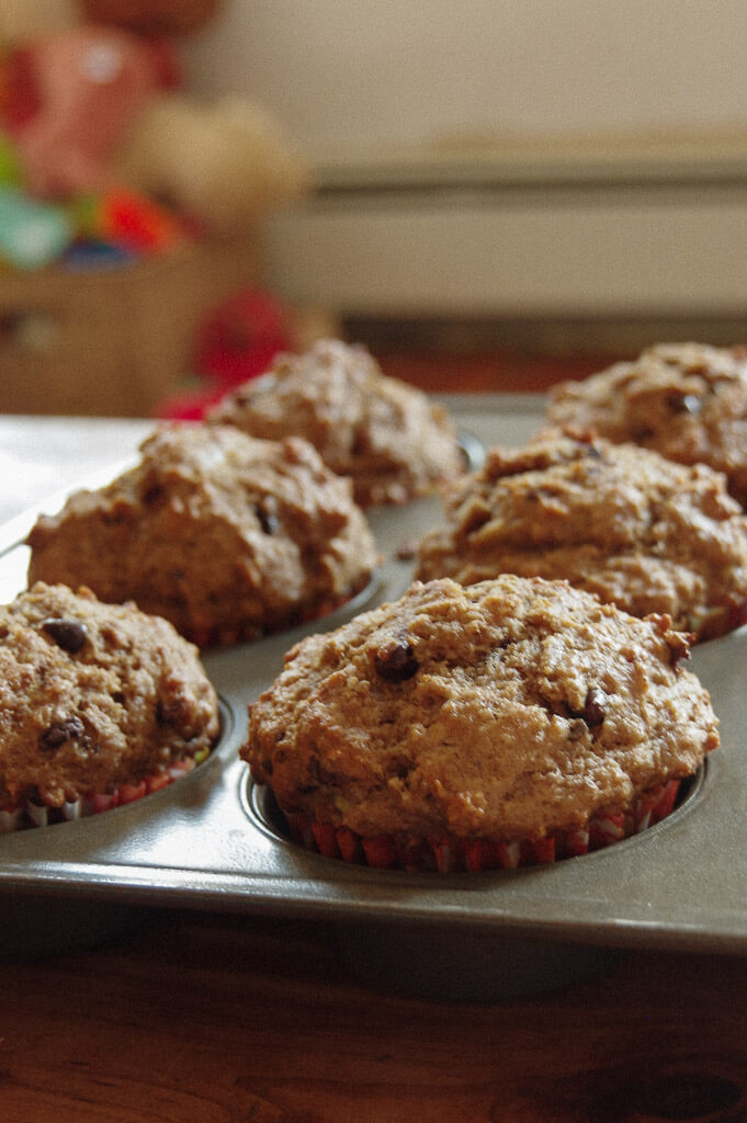 Muffins in a muffin tin with a blurry background