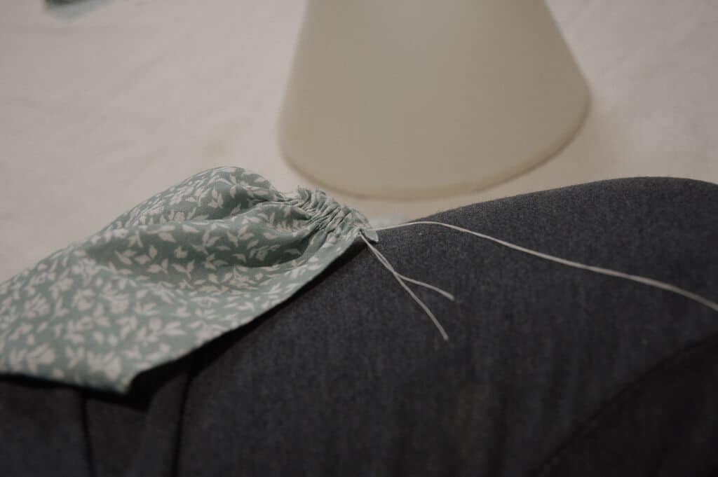 Close up of fabric with knotted thread