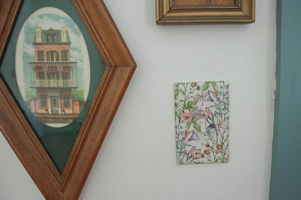 Light switch cover next to frames