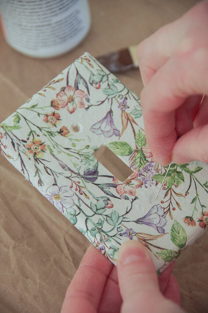 Hand poking light switch cover with sewing pin