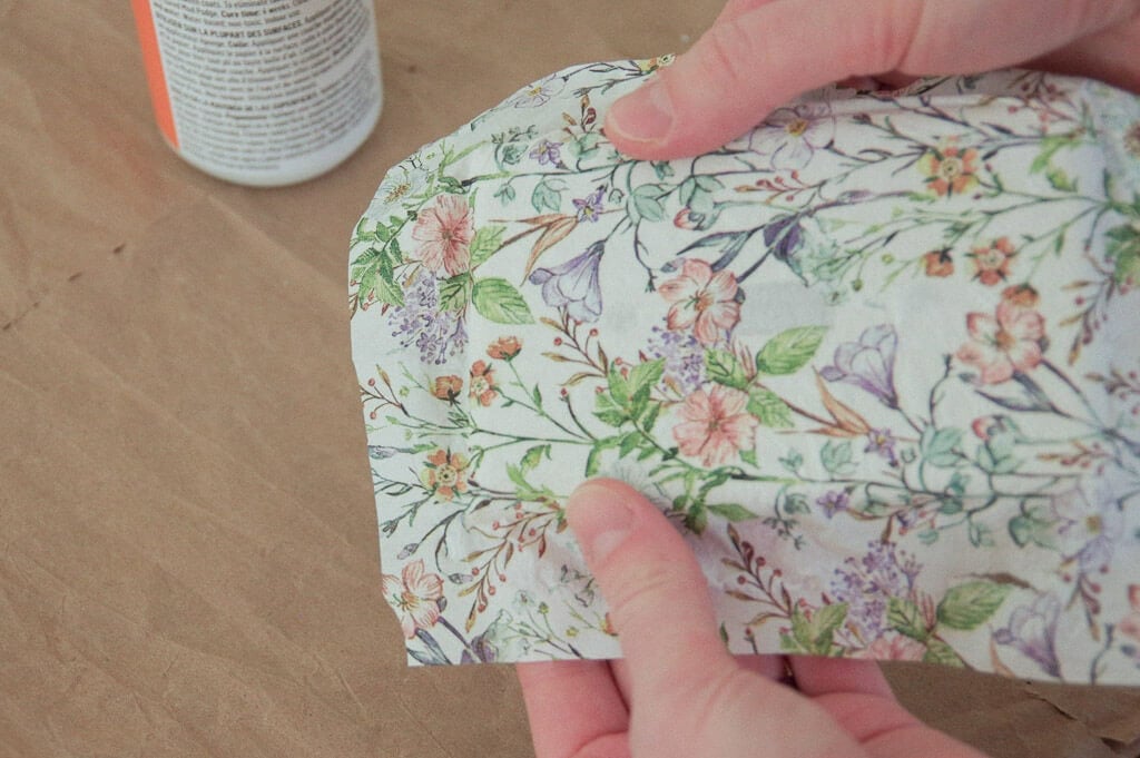 Hands holding floral paper