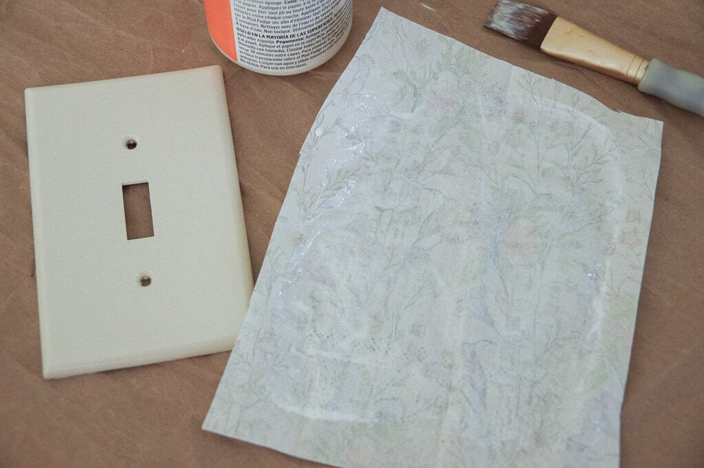 Paper napkin next to light switch plate